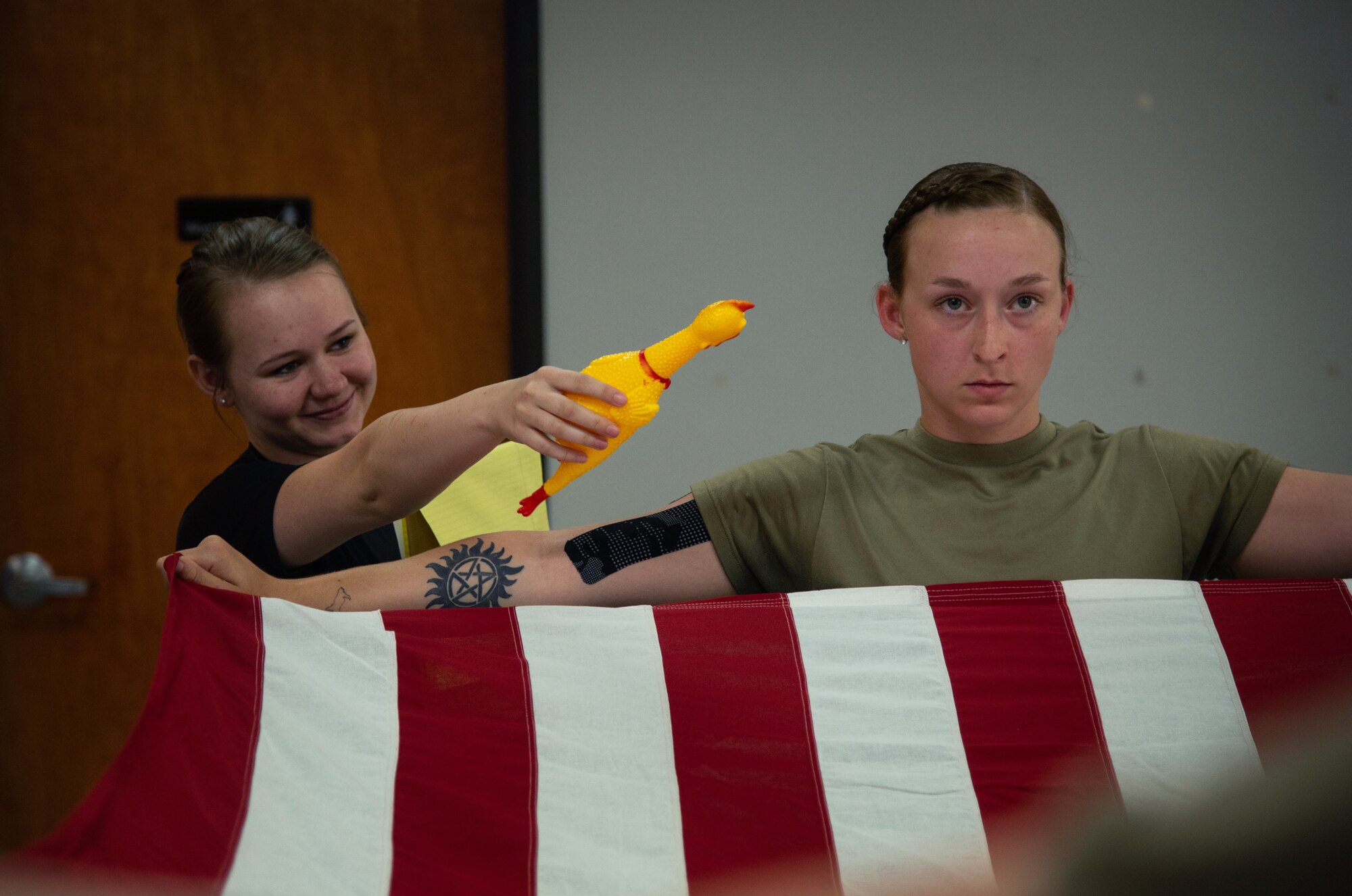 girl holding U.S. flag
