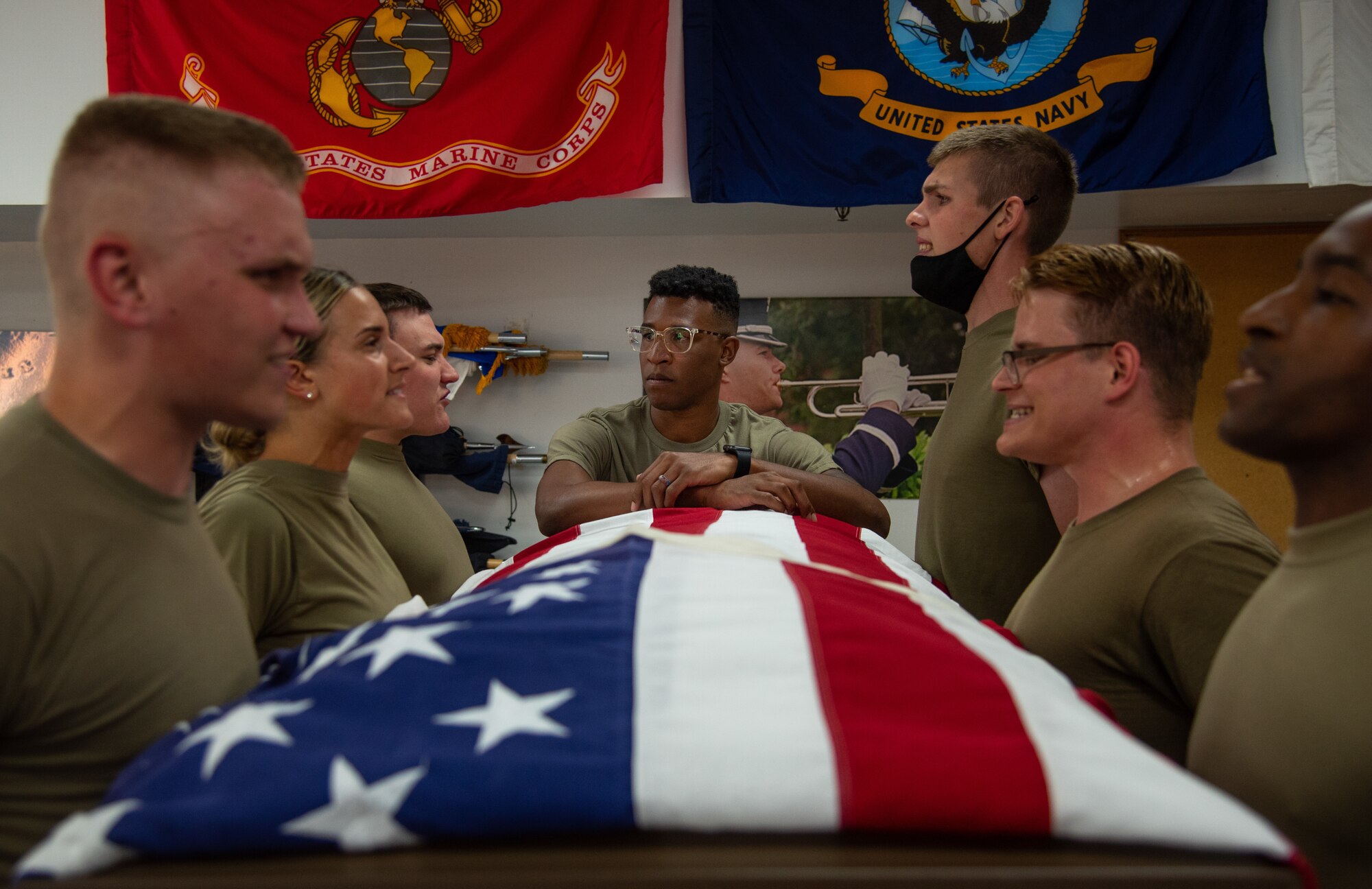 people holding a casket
