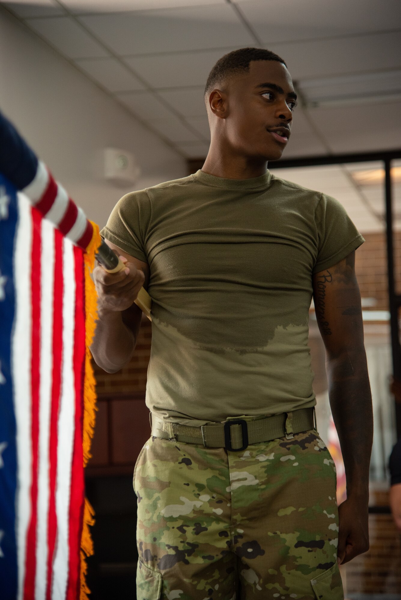 man holding U.S. flag
