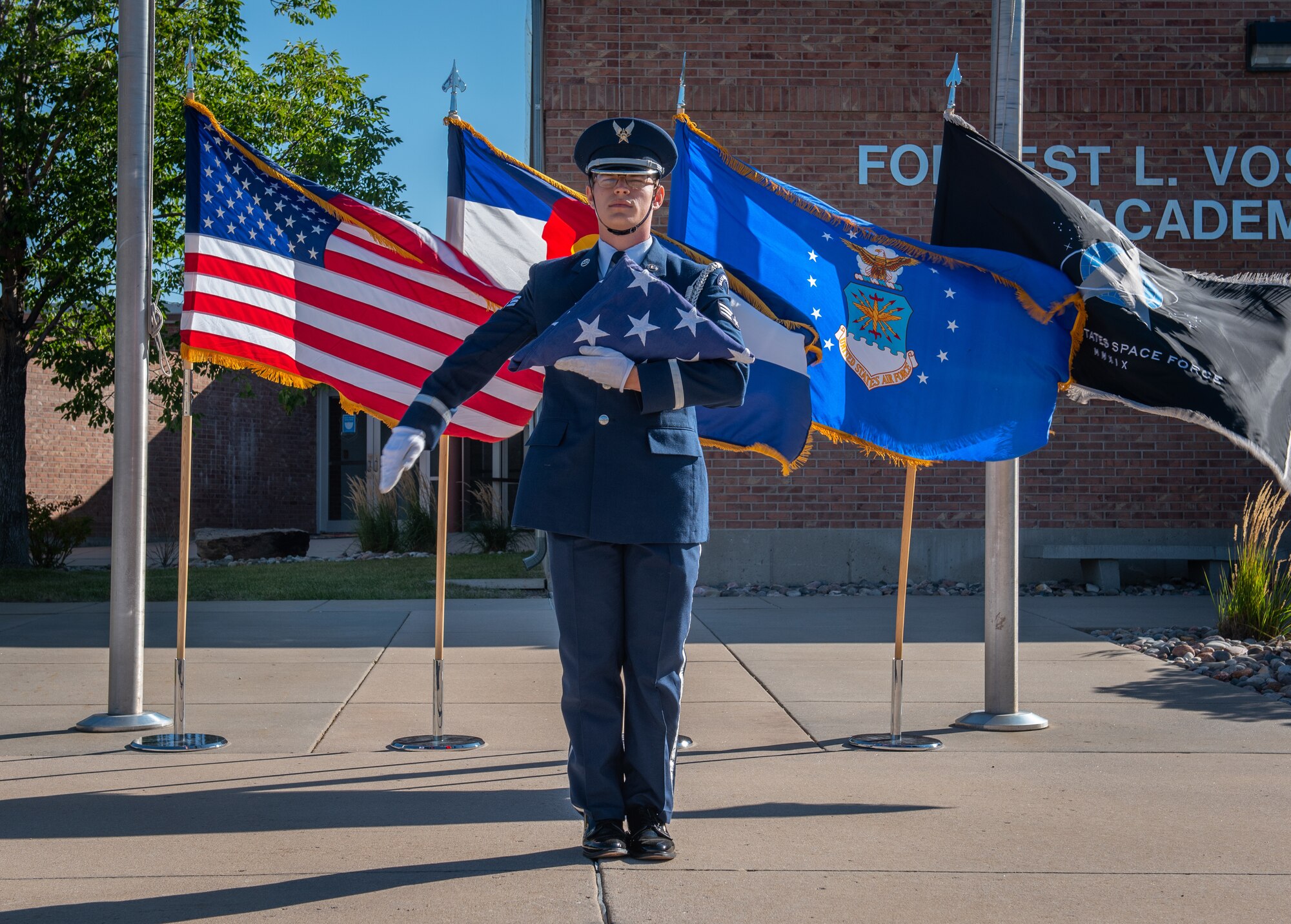 man presenting U.S. flag