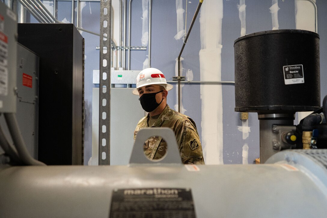 U.S. Army Sgt. Joseph Strupith, 249th Engineer Battalion Charlie Company Prime Power production specialist, assesses a facility’s emergency power generation during Exercise Empire Rising 2021 at the U.S. Naval Academy in Annapolis, Md., July 13, 2021. As part of their National Response Framework mission, the 249th EN BN deploys to provide electrical expertise, conduct pre-installation inspections, and manage, configure, and install generators in support of Emergency Support Functions. (U.S. Army photo by Greg Nash)