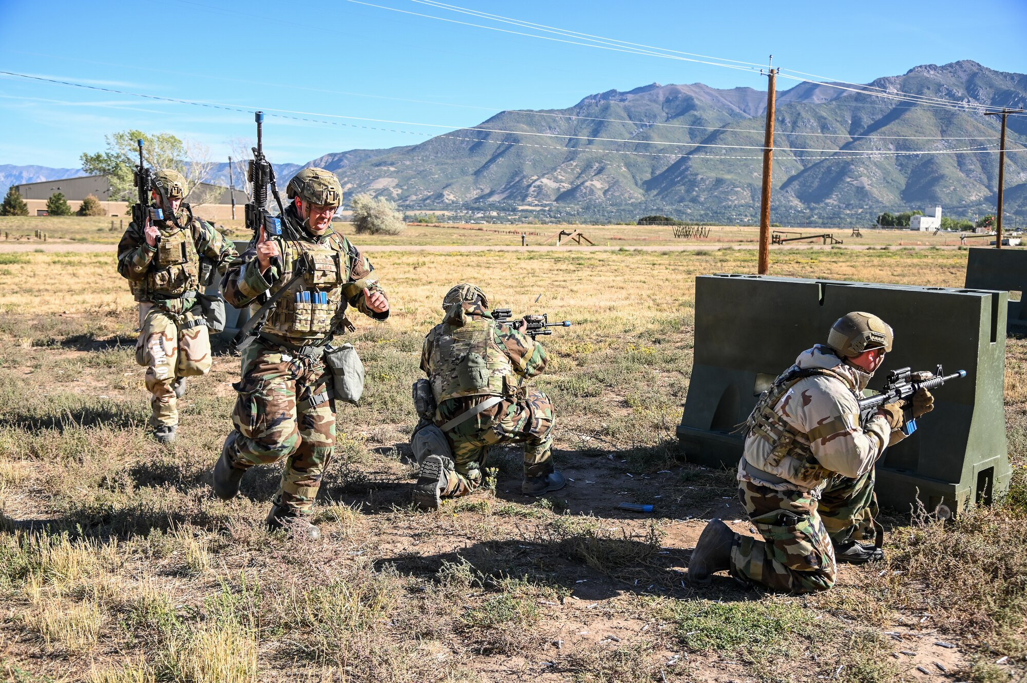 Airmen from 75th Security Forces Squadron perform a "Shoot, Move, Communicate" drill Sept. 22, 2021, at Hill Air Force Base, Utah. Squadrons from the 75th Air Base Wing participated in a phase II readiness exercise where they were assessed on performing different tasks in a simulated toxic environment. (U.S. Air Force photo by Cynthia Griggs)