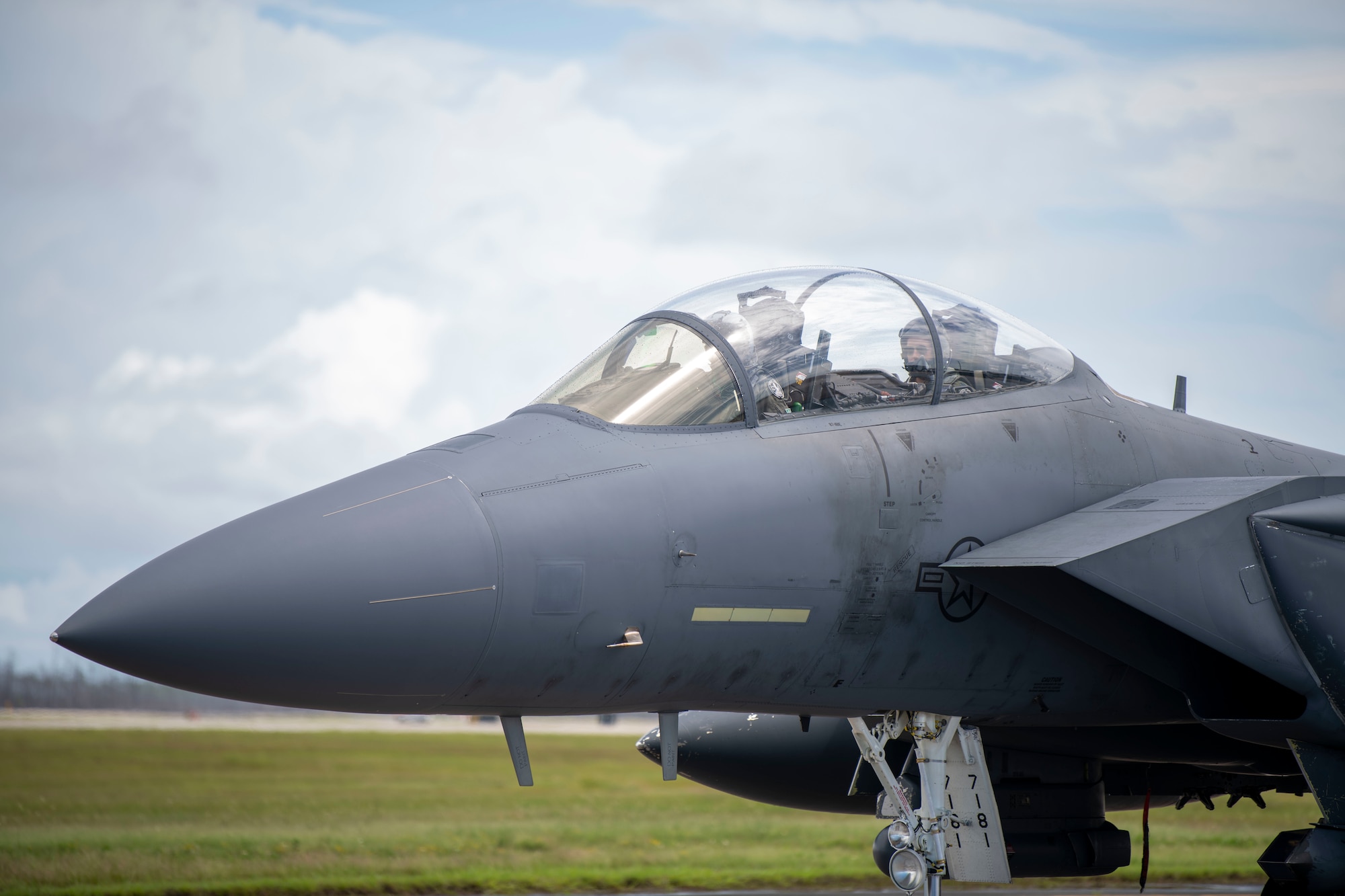 An F-15 on a flight line