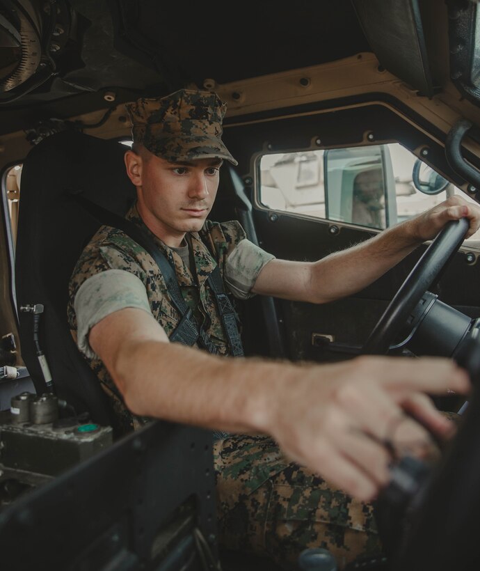 U.S. Marine Corps Lance Cpl. Cameron L. Holland, an Augusta, Ga., native and motor transport operator with 2d Battalion, 2d Marine Regiment, 2d Marine Division, poses for a photo on Camp Lejeune, N.C., Sept. 23, 2021. “There’s always a light at the end of the tunnel, it’s just how you see it,” Holland said. According to his leadership, Holland goes above and beyond the call of duty. He constantly has a positive attitude and sets the example. Congratulations Lance Cpl. Holland on being the Motivator of the Week! (U.S. Marine Corps photo by Lance Cpl. Emma Gray)