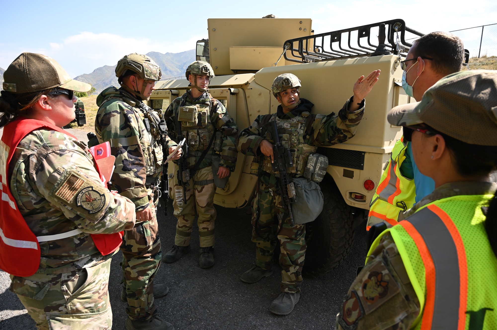 Master Sgt. Byron Price, 75th Security Forces Squadron, speaks with an inspection team during a readiness exercise at Hill Air Force Base, Utah, Sept. 23, 2021. Squadrons from the 75th Air Base Wing participated in a phase II readiness exercise where they were assessed while performing tasks in an austere environment. (U.S. Air Force photo by R. Nial Bradshaw)