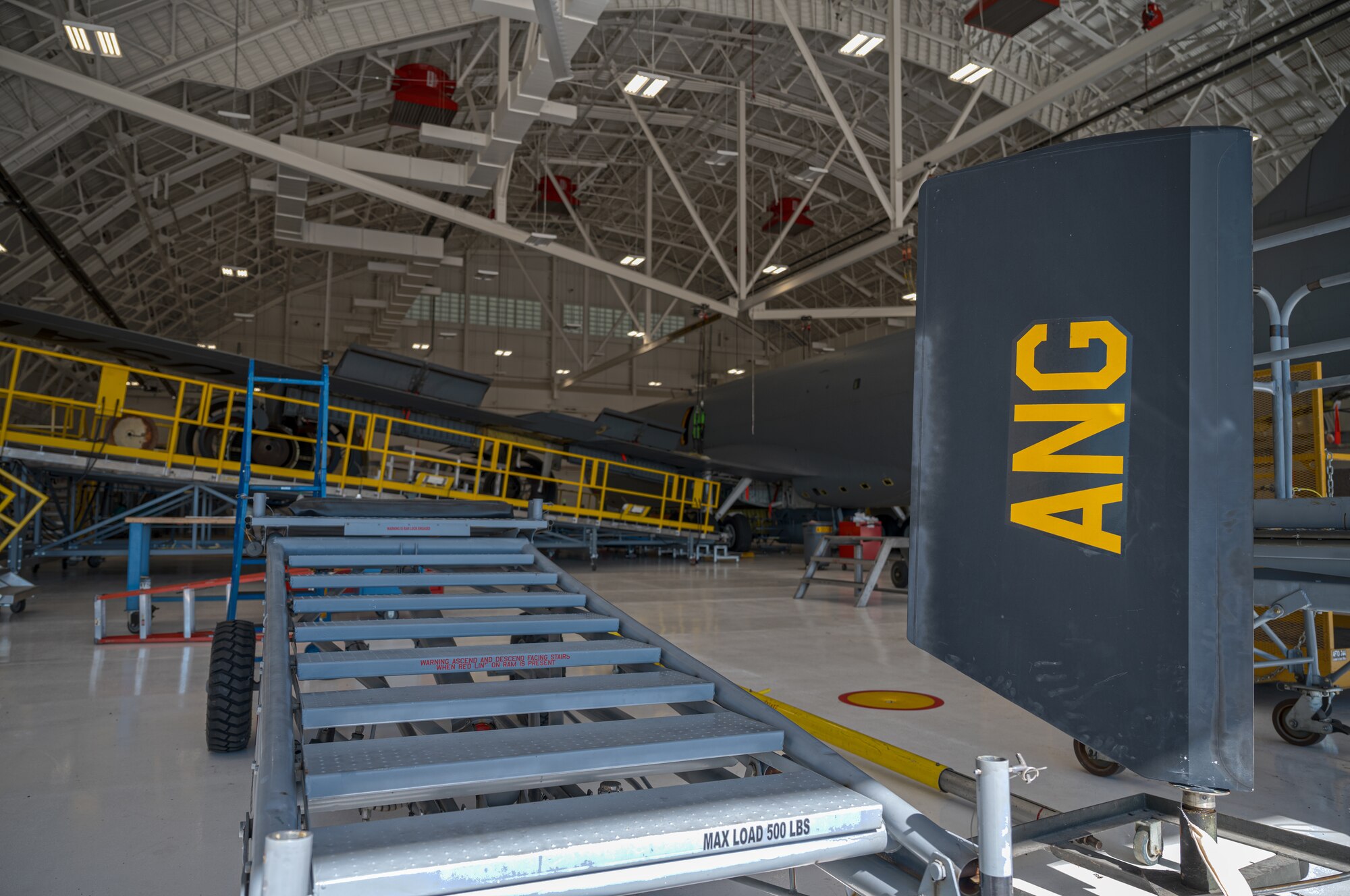 a KC-135 parked in an aircraft hangar