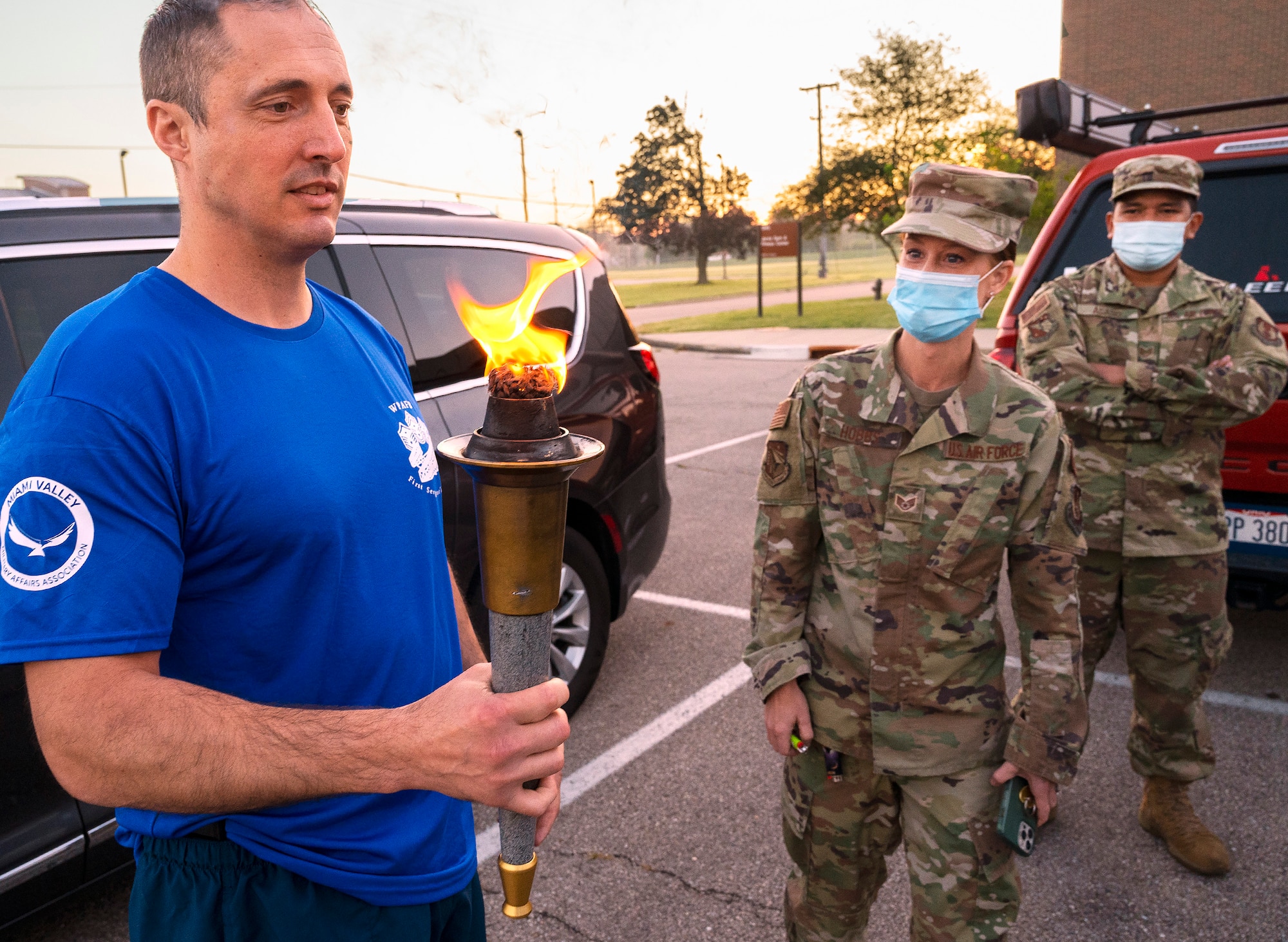 Master Sgt. Brett R. Rosebrook, 88th Surgical Operations Squadron first sergeant, holds the torch before the start of the annual POW/MIA run Sept. 17, 2021, leading to the POW/MIA Recognition Day wreath-laying ceremony at Wright-Patterson Air Force Base, Ohio. The Wright-Patt First Sergeants Council and Chiefs Group split the 6.2-mile course that took the torch and POW/MIA Flag through the base’s Area A. (U.S. Air Force photo by R.J. Oriez)