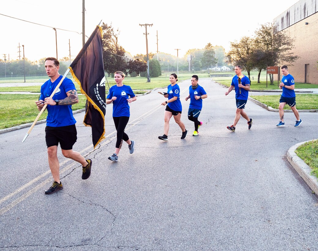 A delegation of first sergeants takes off at the start of the annual POW/MIA run Sept. 17, 2021, leading to the POW/MIA Recognition Day wreath-laying ceremony at Wright-Patterson Air Force Base, Ohio. National POW/MIA Recognition Day is marked each year on the third Friday in September to remember those held captive or missing in action. (U.S. Air Force photo by R.J. Oriez)