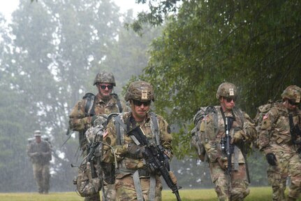 Soldiers with the Tennessee Army National Guard conducted a squad movement in the rain during the First Line Leadership Course pilot in Smyrna on Sept. 15.