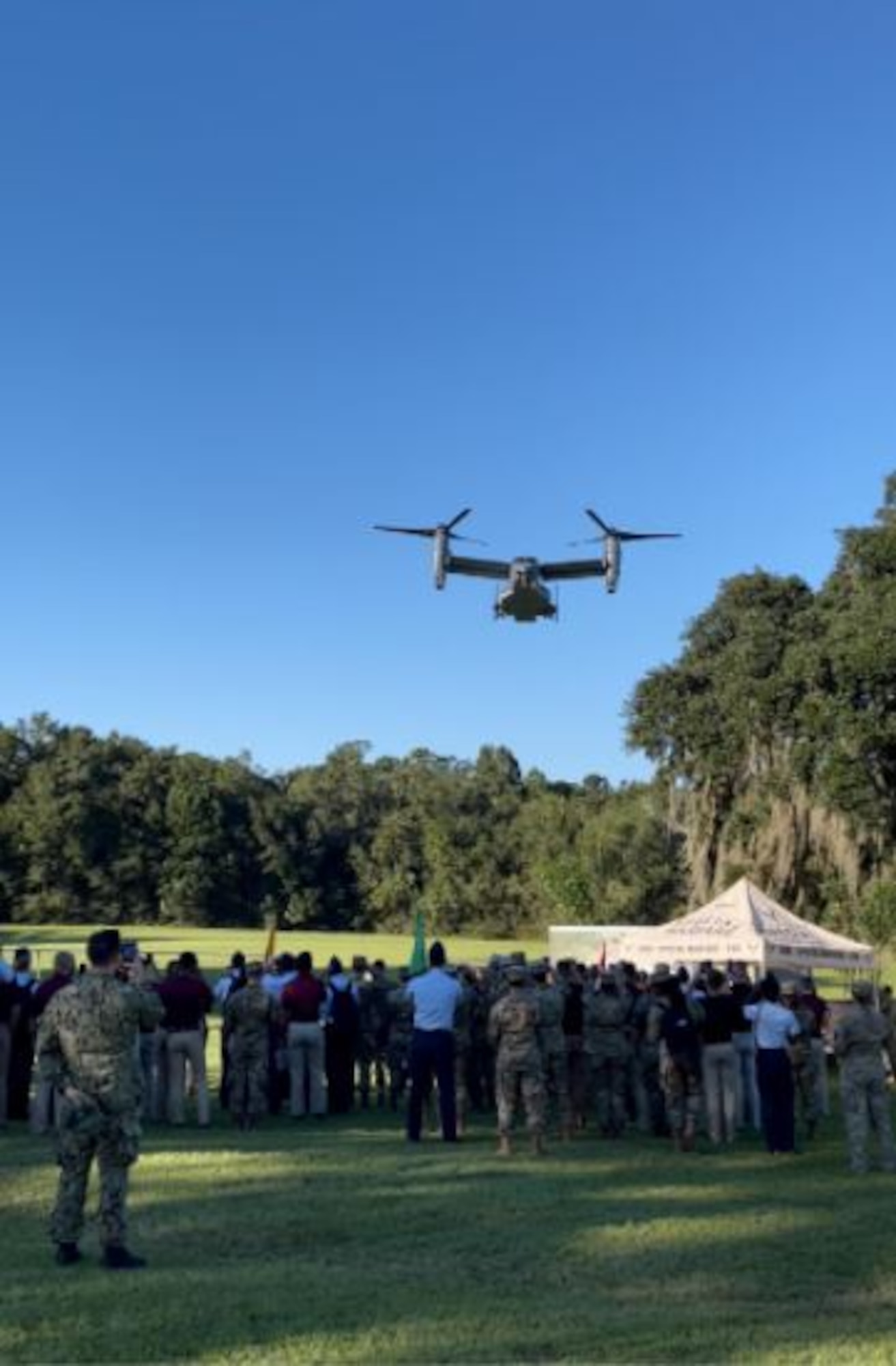 ROTC cadets from Florida State University and Florida A&M University watch as special tactics officers and pilots work together to land a CV-22B tiltrotor aircraft in a field at the FSU campus Sept. 23, 2021. The aircraft flew in and displayed its capability to hover and land vertically. (Courtesy photo)