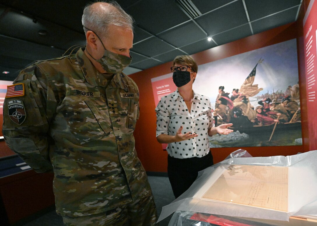 Defense Intelligence Agency Director Lt. Gen. Scott Berrier and Library of Congress representative Rachel Waldron discuss the first George Washington letter to be on display in the DIA Museum.