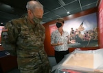Defense Intelligence Agency Director Lt. Gen. Scott Berrier and Library of Congress representative Rachel Waldron discuss the first George Washington letter to be on display in the DIA Museum.