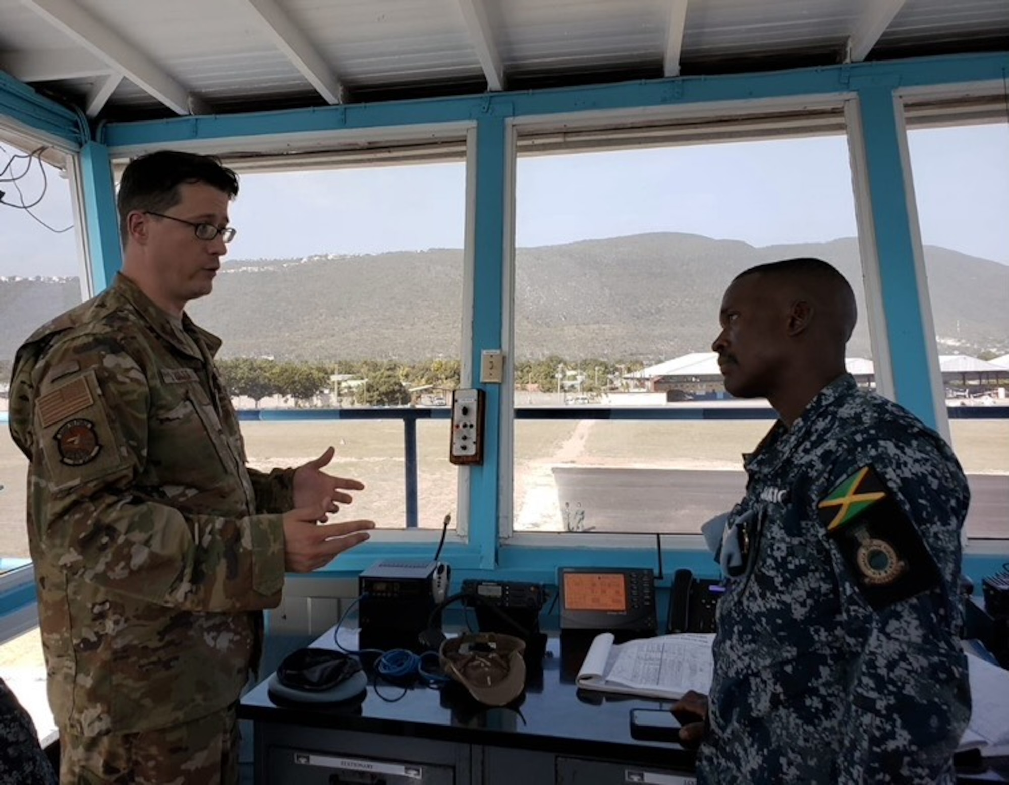 U.S. and Jamaican service members talk in Kingston.