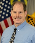 Chris Savage, U.S. Army Financial Management Command Audit Response Center senior financial management analyst, poses for an official photo at the Maj. Gen. Emmett J. Bean Federal Center in Indianapolis Feb. 24, 2021. Savage was recently named as a recipient of the 2020 Louis Dellamonica Award for Outstanding U.S. Army Materiel Command Personnel of the Year. (U.S. Army photo by Mark R. W. Orders-Woempner)