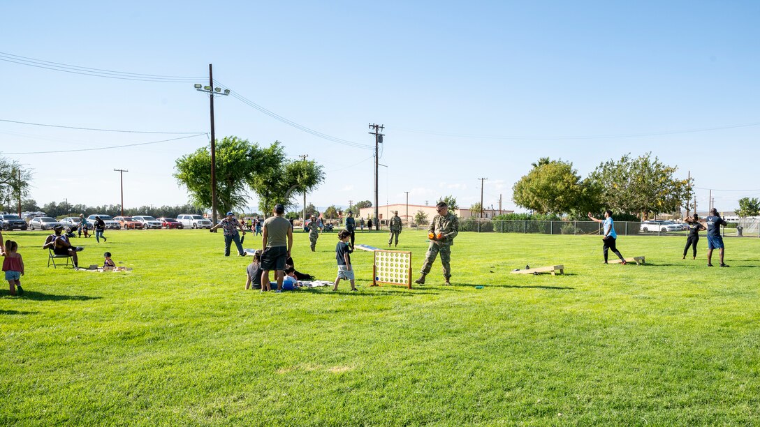 Team Edwards and family members enjoy a picnic in celebration of the Air Force's 74th birthday at Wings Field on Edwards Air Force Base, California, Sept. 17. (Air Force photo by Katherine Franco)