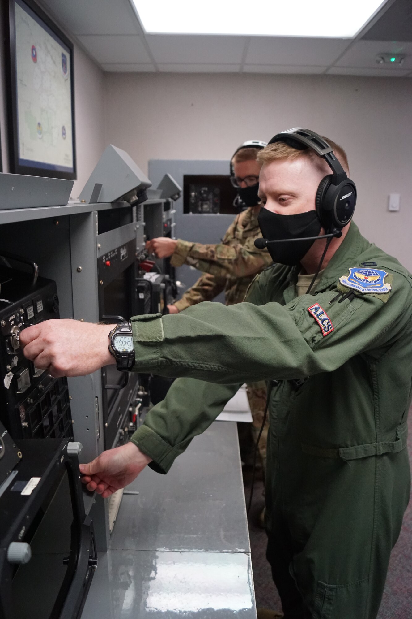 Maj. Alex Foos (back), 625 STOS assistant director of operations, and Capt. Raun Carnley (front), ALCS operator, turn launch keys to a simulated ICBM launch from F.E. Warren Air Force Base, Wyo., Sept. 20, 2021. (U.S. Air Force photo by Ben Guenther)