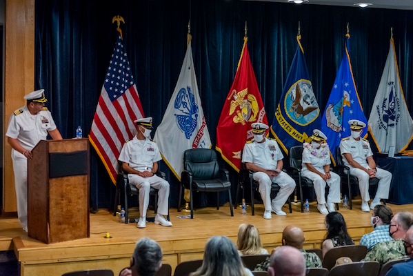 Capt. Dean Muriano, reads his orders to report as commanding officer, Center for Explosive Ordnance Disposal and Diving (CEODD), during a change of command ceremony where Muriano relieved Capt. Keith Dowling, Sept. 22.