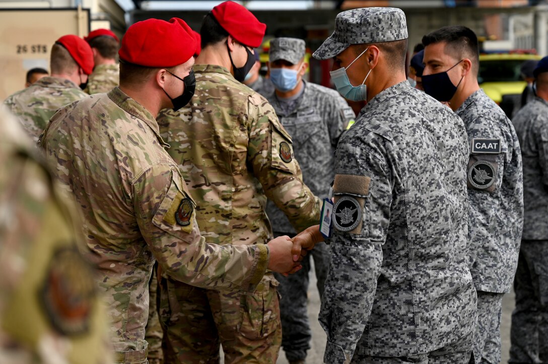 U.S. Air Force Special Tactics operators from the 24th Special Operations Wing greet their Colombian Air Force counterparts Aug. 29, 2021, before the start of events at Ángel de los Andes Cooperación VII in Rionegro, Colombia.
