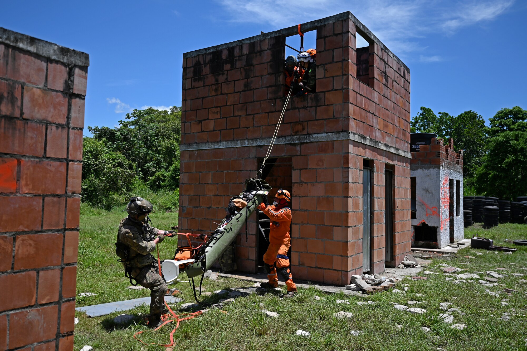 U.S. Air Force Special Tactics operators from the 24th Special Operations Wing work together with humanitarian aid and medical personnel from Colombia and other partner nations in order to rescue a simulated casualty from an exercise disaster zone Sept. 2, 2021,