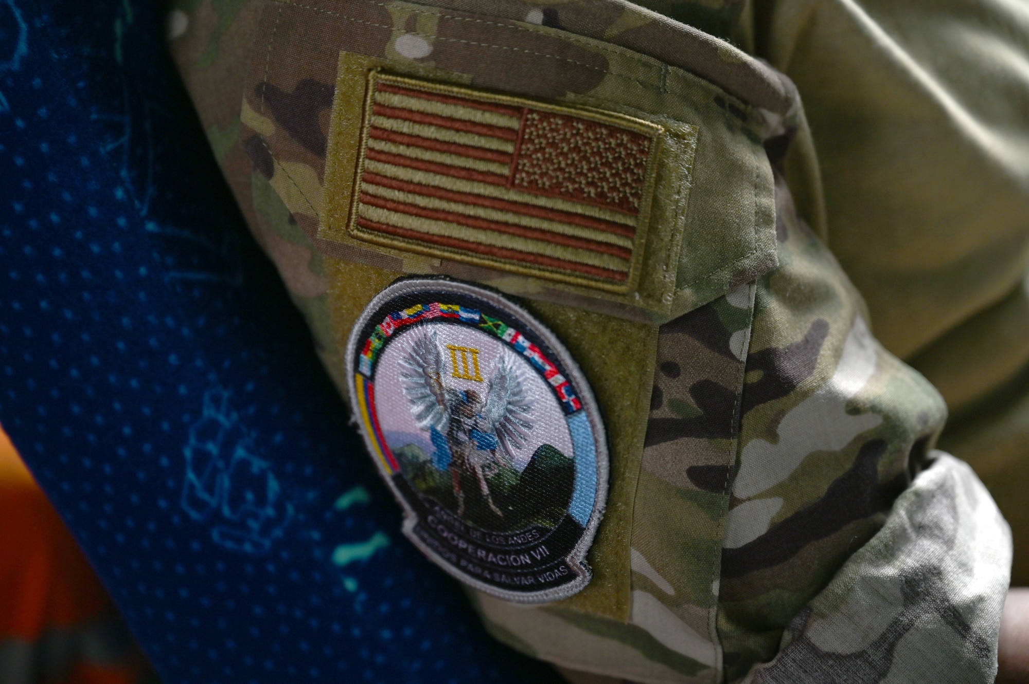 A U.S. Airman from the 24th Special Operations Wing wears the exercise patch of Ángel de los Andes Cooperación VII Sept. 2, 2021, in Rionegro, Colombia.