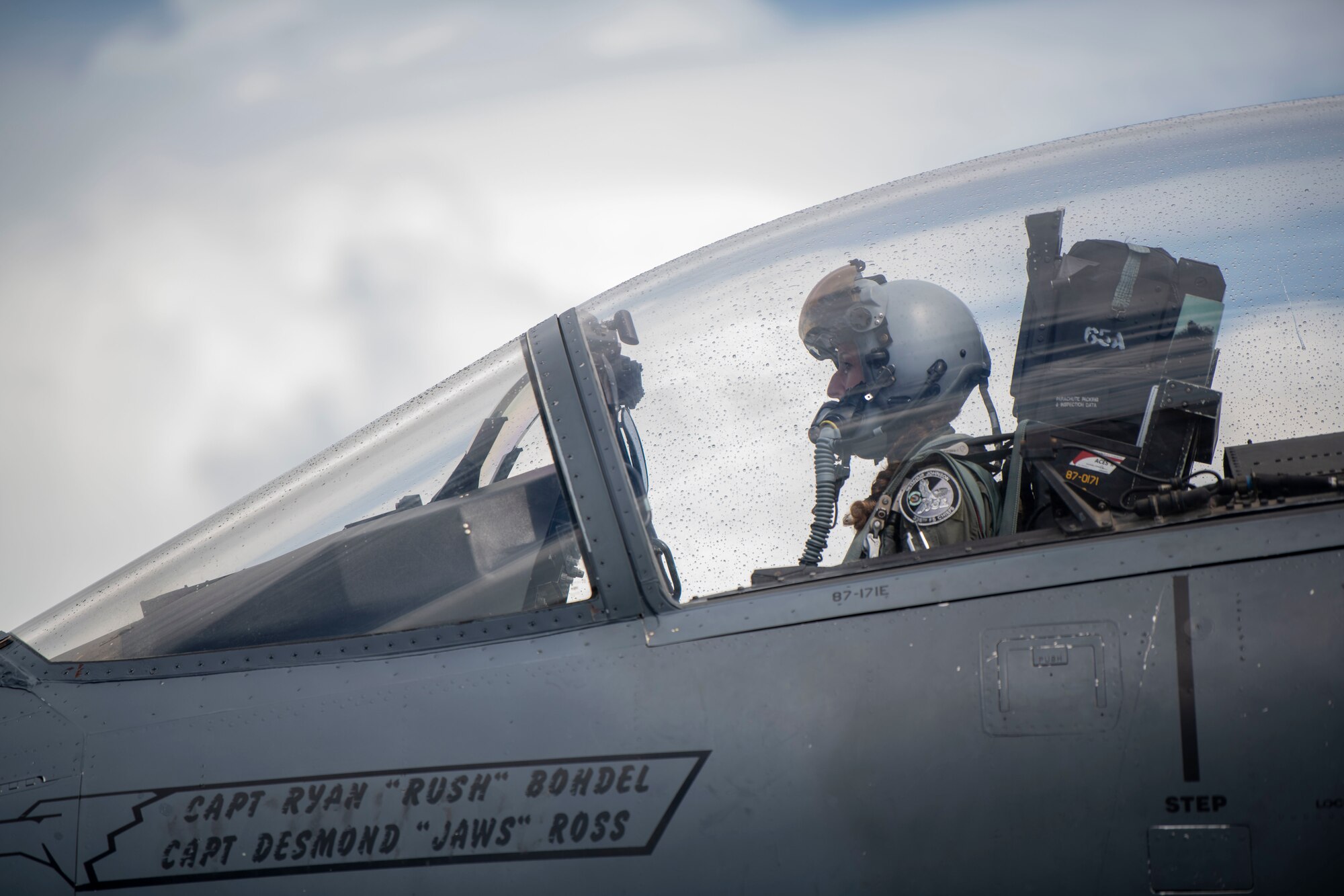 Pilot sitting in the cockpit of a plane