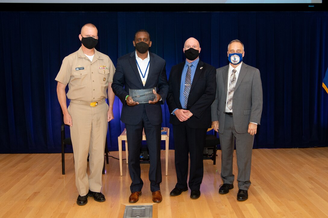 Naval Surface Warfare Center, Carderock Division Commanding Officer Capt. Todd E. Hutchison, Platform Integrity Department Head Jeff Mercier and Technical Director Larry Tarasek present the Vice Adm. Samuel L. Gravely Award.