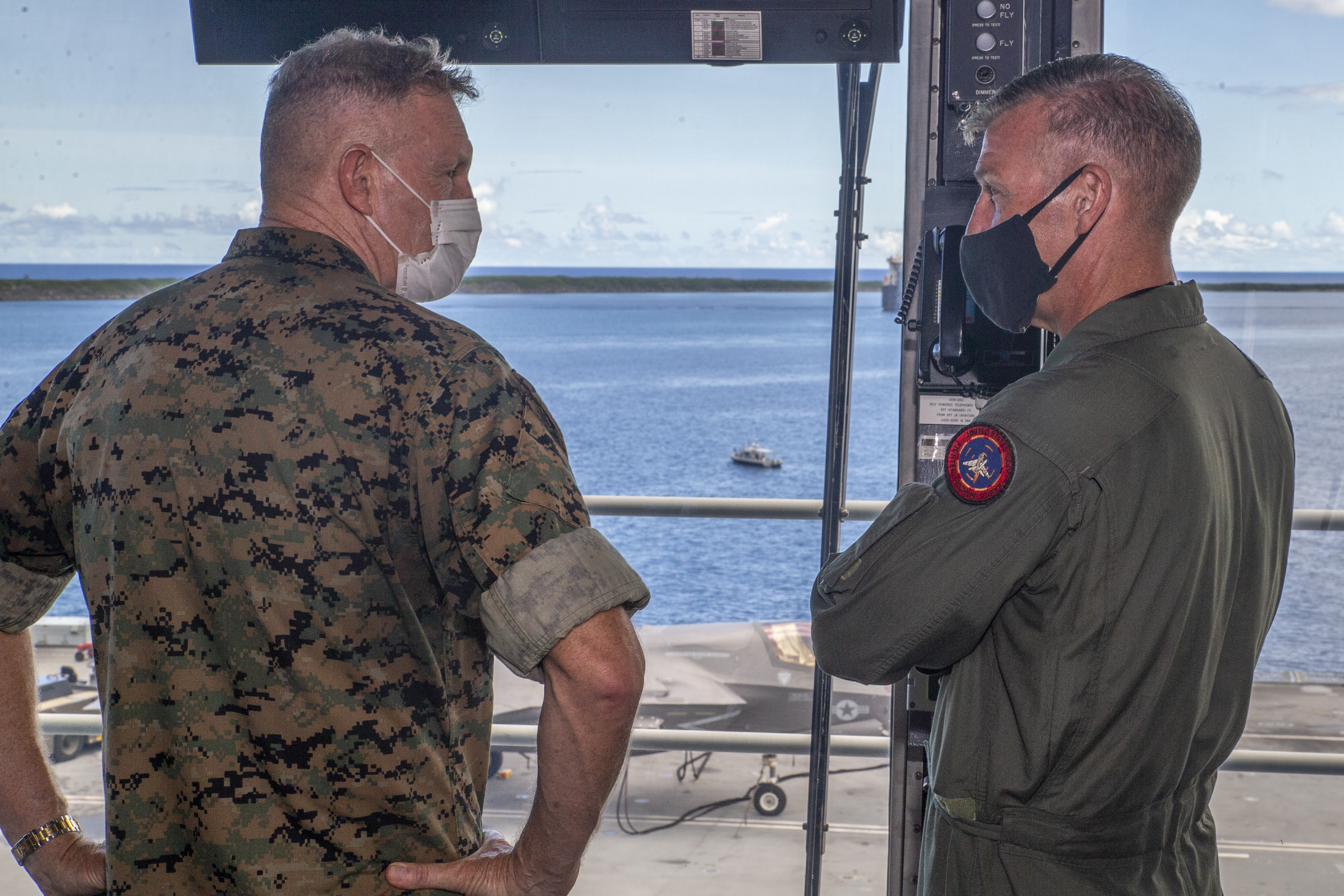 Col. Simon Doran, the U.S. Senior National Representative, U.K. Carrier Strike Group, right, briefs Brig. Gen. William Bowers, the commanding general of Marine Corps Installations Pacific, during a tour of the HMS Queen Elizabeth, which is docked at U.S. Naval Base Guam (NBG), Sept. 20, 2021.