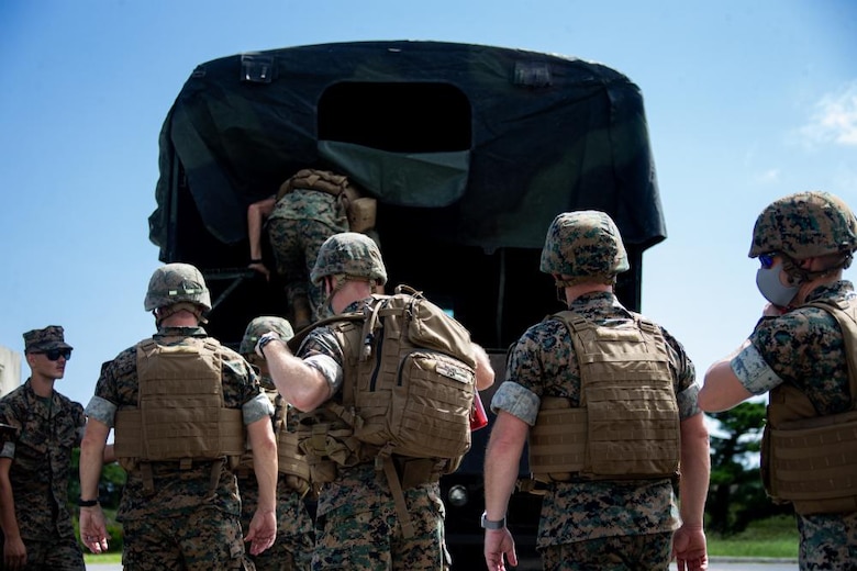 U.S. Marines with 3d Marine Expeditionary Brigade Alert Contingency Marine Air Ground Task Force, load into a 7-ton medium tactical vehicle during an ACM drill at Camp Courtney, Okinawa, Japan, Sept. 22, 2021. 3d MEB is III Marine Expeditionary Force’s Fire Brigade, ready to respond to a wide range of crisis events throughout the Indo-Pacific region as a command-and-control node or as the nucleus of a Joint Task Force, from delivering humanitarian assistance during natural disasters to combat operations. This successful ACM drill showcased the 3d MEB’s readiness and validated 3d MEB’s ability to rapidly activate and deploy a Forward Command Element. (U.S. Marine Corps photo by Lance Cpl. Ujian Gosun)