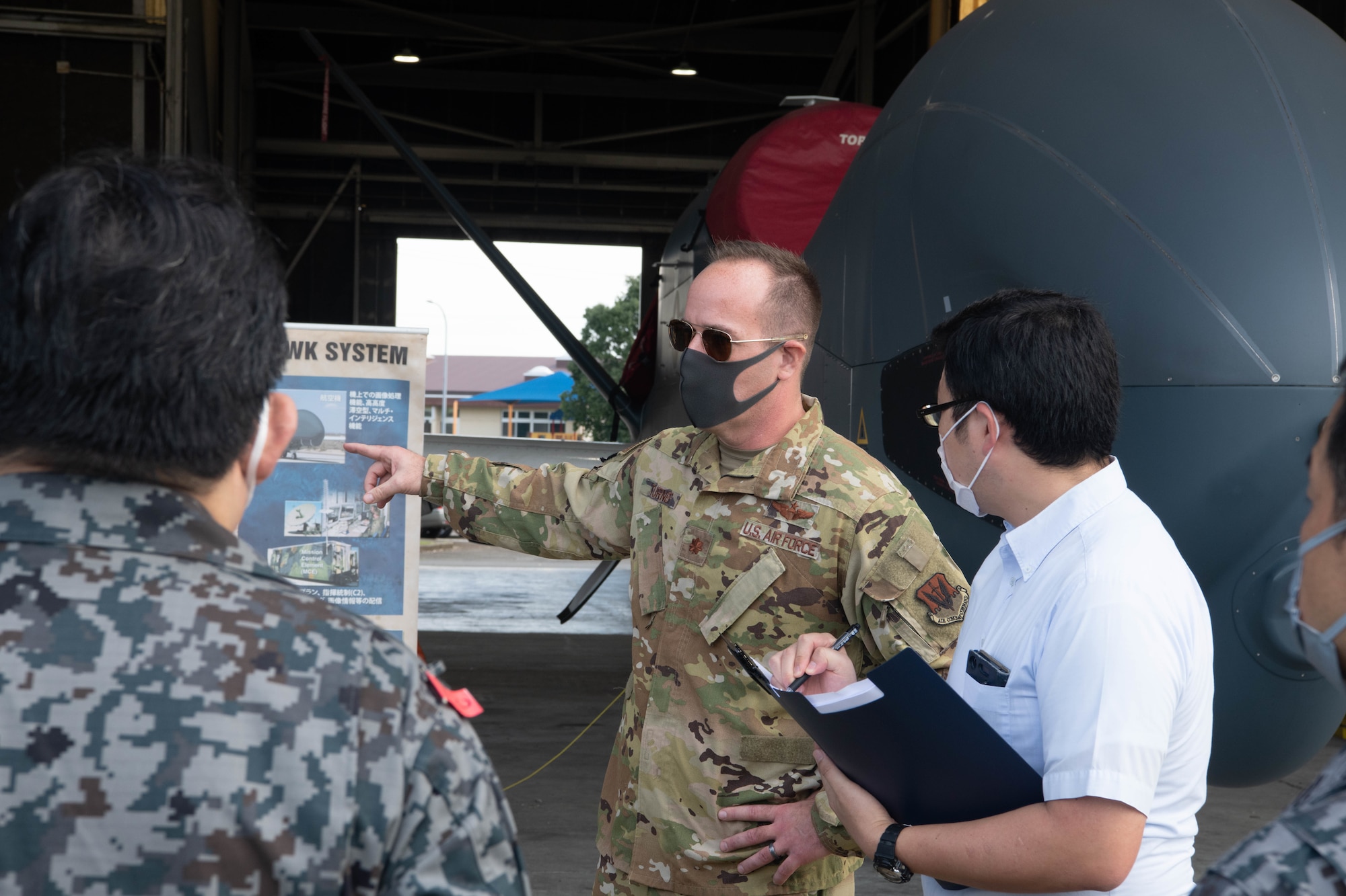 Members of Air Defense Command visited the 319th Operations Group Det. 1, for a U.S. Air Force Global Hawk subject matter expert exchange at Yokota Air Base, Japan, Sept. 22, 2021.