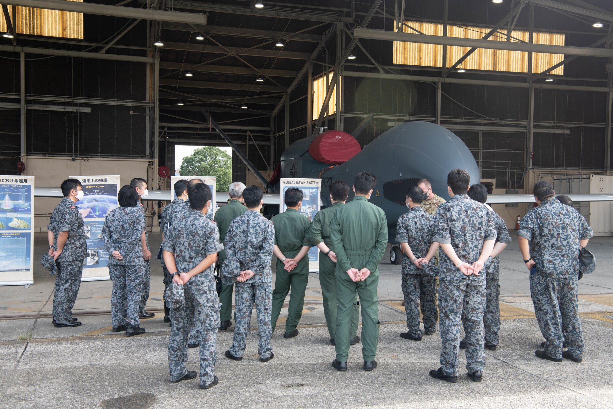 Members of Air Defense Command visited the 319th Operations Group Det. 1, for a U.S. Air Force Global Hawk subject matter expert exchange at Yokota Air Base, Japan, Sept. 22, 2021.