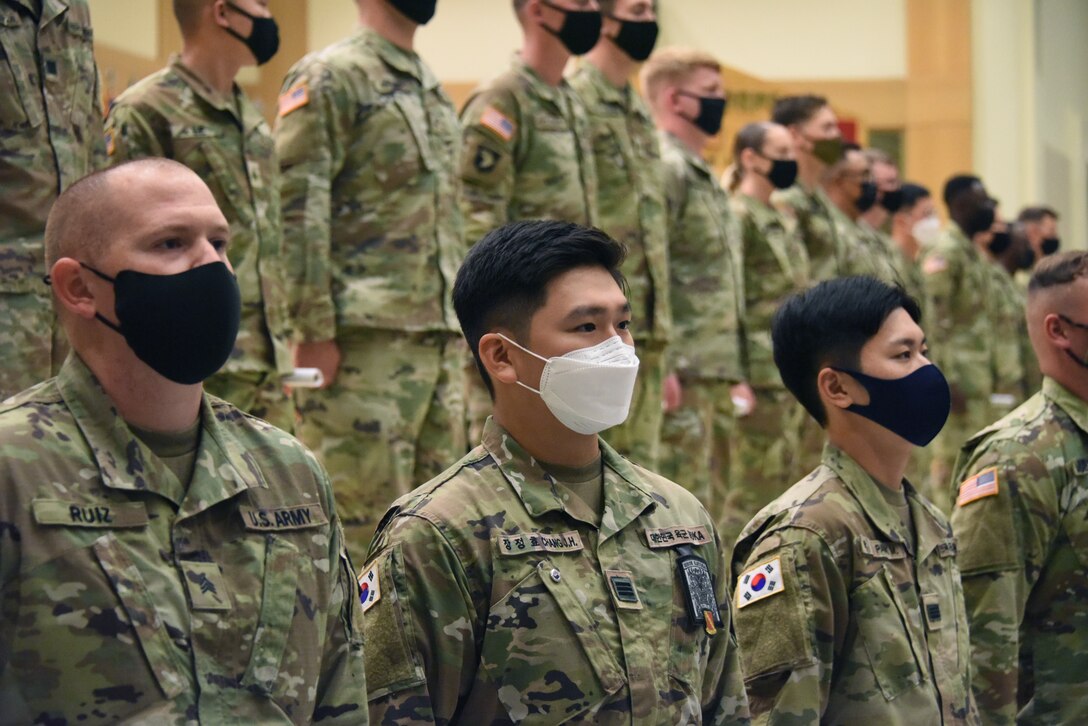 ROK Army KATUSA Cpl. Jung Hyo Chang, senior KATUSA with 6-52 ADA Battalion, stands with fellow KATUSAs and NCOs during the 6-52 ADA Battalion NCO induction ceremony. (US Army photo by Ms. Amelia M. Gillies)