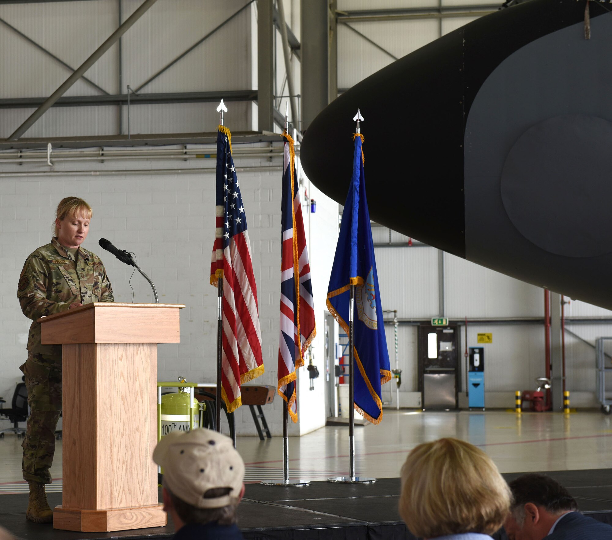 U.S. Air Force Senior Master Sgt. Jessica Mueller, 100th Maintenance Group Maintenance Operations superintendent, emcees at the Rosie’s Riveters’ nose art unveiling event at Royal Air Force Mildenhall, England, June 10, 2021. Mueller was a senior airman stationed at Ellsworth Air Force Base, South Dakota, Sept. 11, 2001. She shared her experience of that day, and how it affected her life’s journey and military career, on the 20th anniversary of 9/11. (U.S. Air Force photo by Karen Abeyasekere)