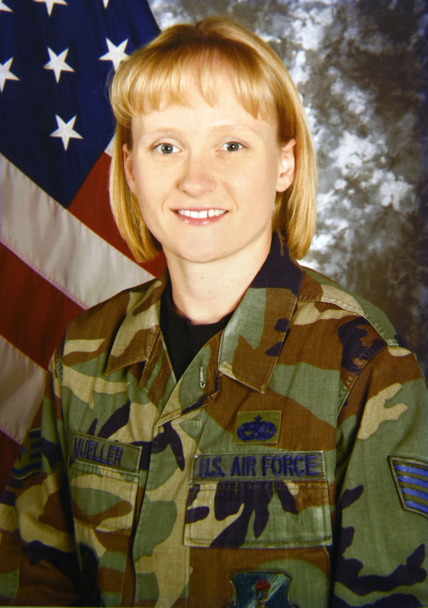 U.S. Air Force then-Staff Sgt. Jessica Mueller, now senior master sergeant and 100th Maintenance Group Maintenance Operations superintendent, poses for her official photo at Grand Forks Air Force Base, North Dakota, in 2006. Mueller has been a maintenance analyst on B1 Lancer, A-10 Warthog and KC-135 Stratotanker aircraft, and was stationed at Ellsworth Air Force Base, South Dakota, on Sept. 11, 2001. Mueller shared her memories of 9/11 in an article for the 20th anniversary of the 9/11 terrorist attacks. (U.S. Air Force photo)