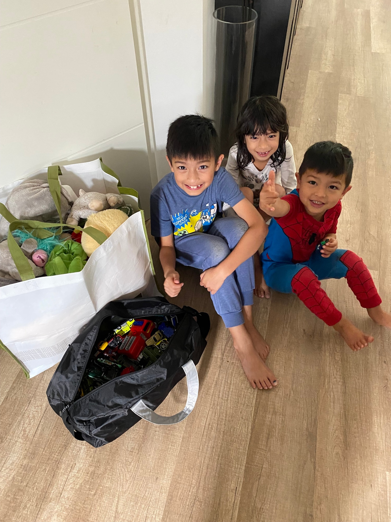 Kids pose with toy donations.