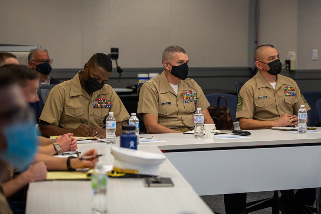 Major General Jason Bohm, Brig. Gen. Ahmed Williamson, and Sergeant Major Adan Moreno receive a presentation regarding Machine Learning and Artificial Intelligence from Johns Hopkins University Applied Physics Laboratory (APL) staff members at APL’s Laurel, Md., campus on September, 22 2021. Marine leaders are researching modernization efforts to support the Marine Corps’ force design initiatives of recruiting and retaining talented Marines. (Marine Corps photo by Sgt. Kenny Gomez)