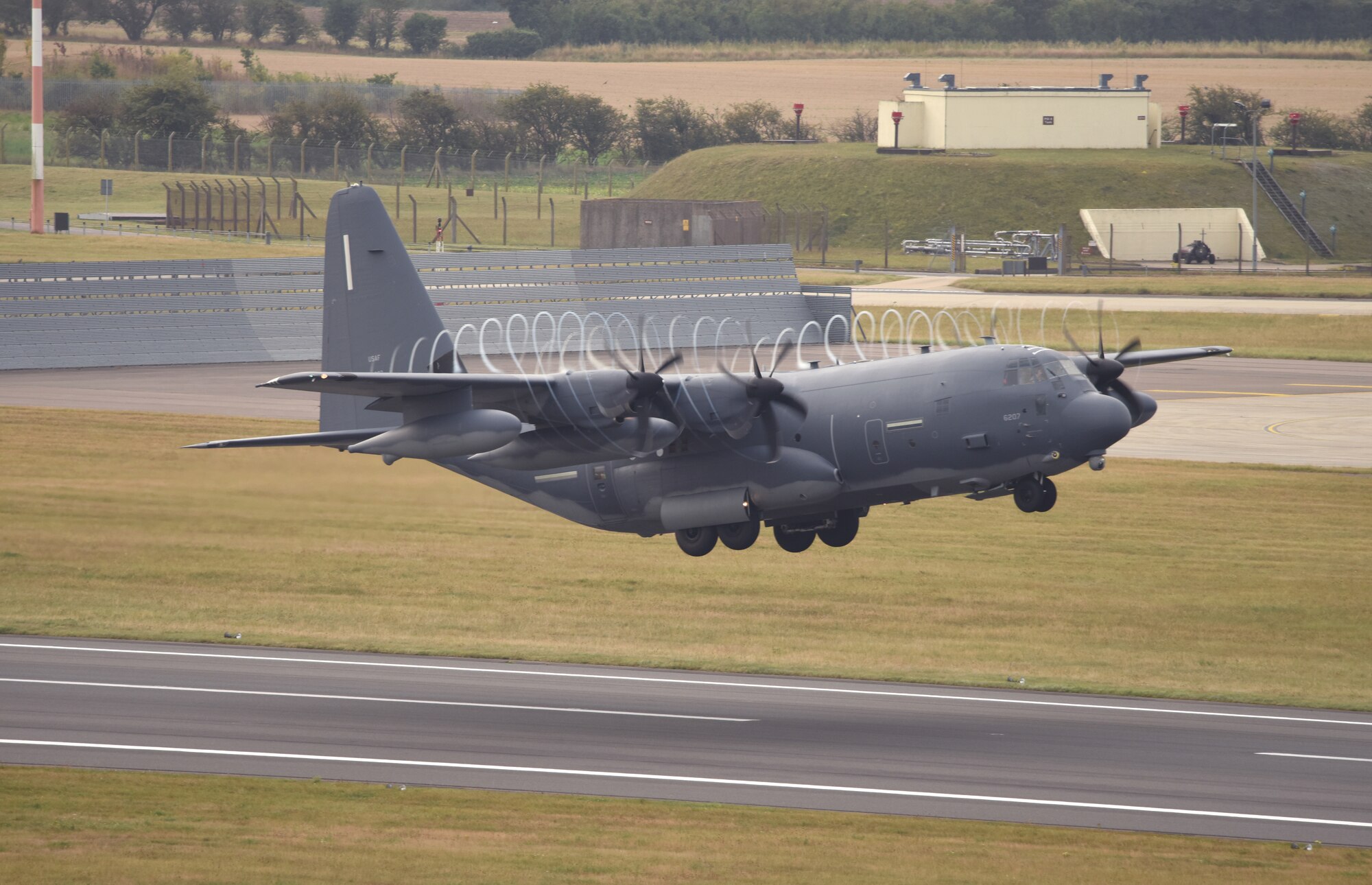 A U.S. Air Force MC-130J Commando II aircraft assigned to the 352nd Special Operations Wing takes off during an elephant walk at Royal Air Force Mildenhall, England, Sept. 13, 2021. An elephant walk is a term used by the U.S. Air Force when multiple aircraft taxi together before takeoff. (U.S. Air Force photo by Karen Abeyasekere)