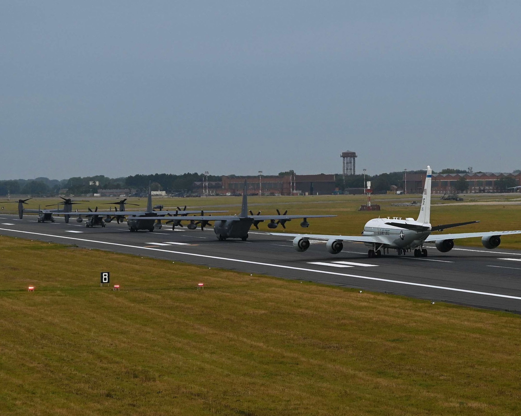 Team Mildenhall aircraft perform an elephant walk at Royal Air Force Mildenhall, England, Sept. 13, 2021. An elephant walk is a term used by the U.S. Air Force when multiple aircraft taxi together before takeoff. (U.S. Air Force photo by Airman 1st Class Viviam Chiu).