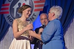 WASHINGTON- Molly Frey, left, receives the Military Child of the Year® award for the National Guard from her grandmother during the 2017 Military Child of the Year® Awards gala at a Ritz-Carlton hotel. Each year, the Military Child of the Year® Award is presented by Operation Homefront to outstanding military children who demonstrate resiliency, leadership and achievement. (U.S. Navy photo my Mass Communication Specialist 3rd Class Eric S. Brann /Released)
