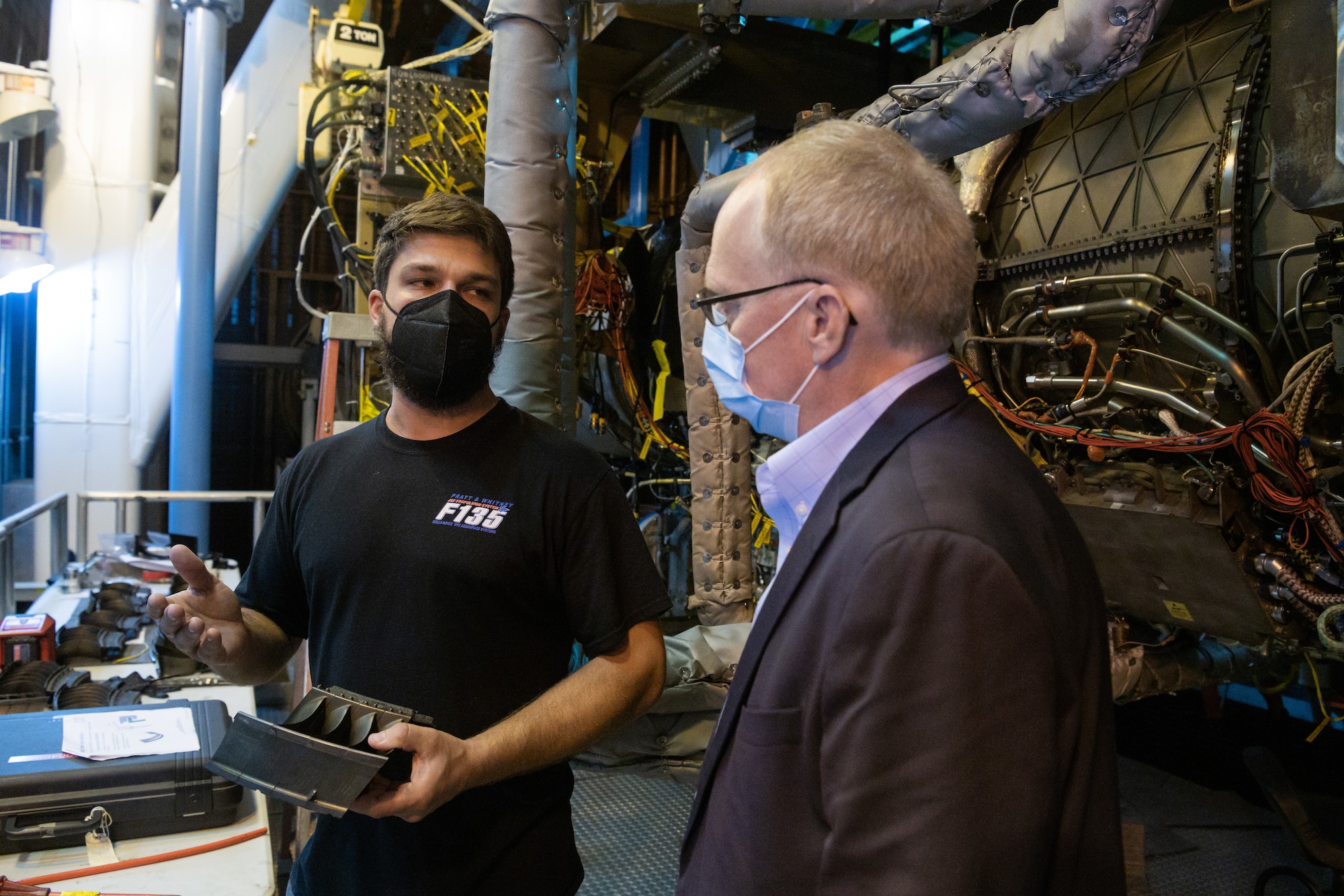 From left, Travis Vitale, a senior development mechanic with Pratt & Whitney, shows Rep. John Rose, of Tennessee, a section of a second stage fan stator for the F135 being tested to validate a new design of the engine component through accelerated mission testing in Sea Level Test Cell 3 (SL-3) as Rose tours the facility during his visit Aug. 31, 2021, to Arnold Air Force Base, Tenn., headquarters of Arnold Engineering Development Complex. Pratt & Whitney is the manufacturer of the F135, the powerhouse of the F-35 Joint Strike Fighter. Engine test facilities, such as those at Arnold AFB, allow new engine components to be rigorously tested and proven before being distributed to the fleet. (U.S. Air Force photo by Jill Pickett)