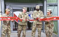From left to right: U.S. Army Sgt. Maj. Francis Famularcano, Col. Shane Roach, commander, both with U.S. Army Medical Materiel Center-Europe, Col. Anthony Nesbitt, commander, and Sgt. Maj. Monnet Bushner both with Army Medical Logistics Command cut the ribbon to the USAMMCE Kaiserslautern Army Depot on Sep. 17, 2021, at Kaiserslautern, Germany. The ceremony formalizes the move from the command’s former base in the Husterhoeh Kaserne in Pirmasens, Germany where it has called home since 1975. USAMMCE provides theater level Class VIII medical supplies for U.S. Army Europe & Africa units.