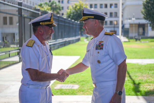 Vice Adm. Gene Black, commander, U.S. Sixth Fleet, right, shakes hands with Vice Adm. Enrico Credendino, Commander in Chief Italian Naval Fleet,