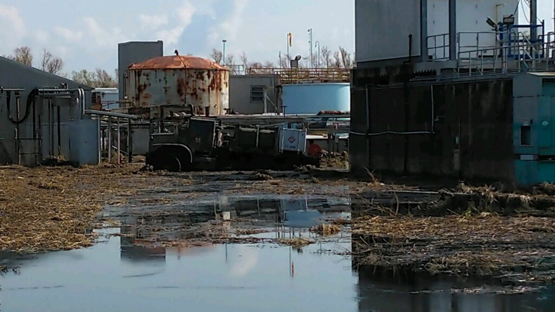 a high water truck stuck in hurricane debris