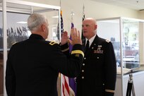U.S. Army Reserve Col. Donald A. (Tony) Vacha, incoming deputy commanding officer for the 353 Civil Affairs Command, recites the oath of office given by Brig. Gen. Robert S. Cooley, chief of staff, U.S. Army Reserve Command, during his promotion ceremony at the John F. Kennedy Special Warfare Center and School, Aug. 27, 2021, Fort Bragg, N.C.