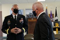 U.S. Army Reserve Brig. Gen. Robert S. Cooley (left), chief of staff, U.S. Army Reserve Command and former commanding general for the 353 Civil Affairs Command, Fort Wadsworth, Staten Island, N.Y., speaks with another former commanding general of the 353 CACOM, Maj. Gen. (Ret.) Hugh Van Roosen (right), former Deputy Military Advisor to the Secretary General of the United Nations, during the promotion ceremony for Col. Donald A. (Tony) Vacha, incoming deputy commanding officer for the 353 CACOM, at the John F. Kennedy Special Warfare Center and School, Aug. 27, 2021, Fort Bragg, N.C.