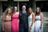 U.S. Army Reserve Col. Donald A. (Tony) Vacha (center), incoming deputy commanding officer for the 353 Civil Affairs Command, stands with daughter Emma Vacha (left), daughter Abigail Vacha (center left), Mrs. Lara Vacha (center right), and daughter Elisabeth Vacha (right) during his promotion ceremony at the John F. Kennedy Special Warfare Center and School, Aug. 27, 2021, Fort Bragg, N.C.