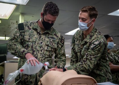 210914-N-DA693-3002 SAN DIEGO (Sept. 13, 2021) Hospital Corpsman 3rd Class Eric Callari, a Sailor embarked with the Medical Treatment Facility's (MTF) Directorate for Nursing Services aboard Military Sealift Command (MSC) hospital ship USNS Mercy (T-AH 19) (left), and Lt. Matthew Kirchoff (right), participate in a resuscitation drill in one of the ship's intensive care units during Mercy Exercise (MERCEX) 21-4 Sept. 13. MERCEX 21-4 is a week-long, pierside