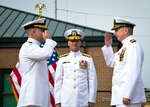 EVERETT, Wash. (September 24, 2021) Capt. Jonas C. Jones, outgoing commander, Navy Region Northwest Reserve Component Command (NRNW RCC) Everett, solutes Capt. Jason E. Small, after reading of official BUPERS orders. Capt. Jason E. Small relieved Capt. Jonas C. Jones as the 26th Commander of Navy Region Northwest Reserve Component Command Everett. (U.S. Navy photo by Mass Communication Specialist 1st Class Kleynia R. McKnight)