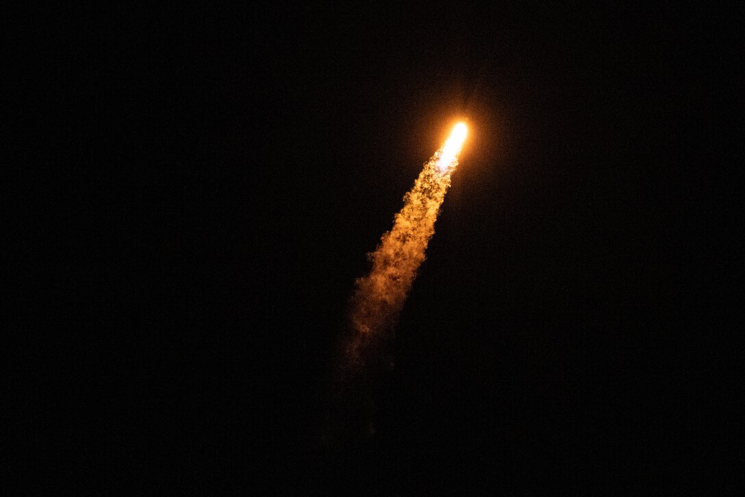 A rocket soars through space.