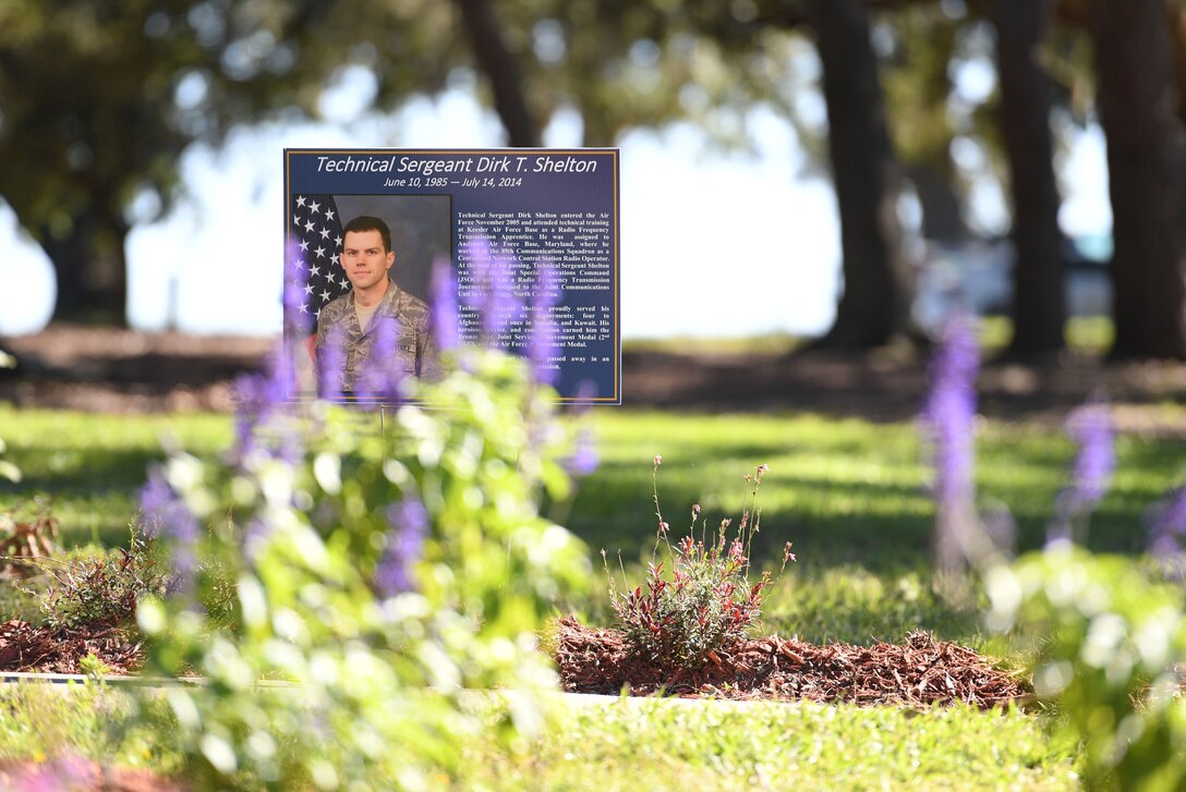 A memorial sign is displayed during the Air Force Families Forever Fallen Heroes Butterfly Garden dedication ceremony at the marina park at Keesler Air Force Base, Mississippi, Sept. 24, 2021. The garden was created as a designated location where the families of our fallen heroes can find a serene area to pay tribute to their loved one as well as honoring our fallen service members. (U.S. Air Force photo by Kemberly Groue)