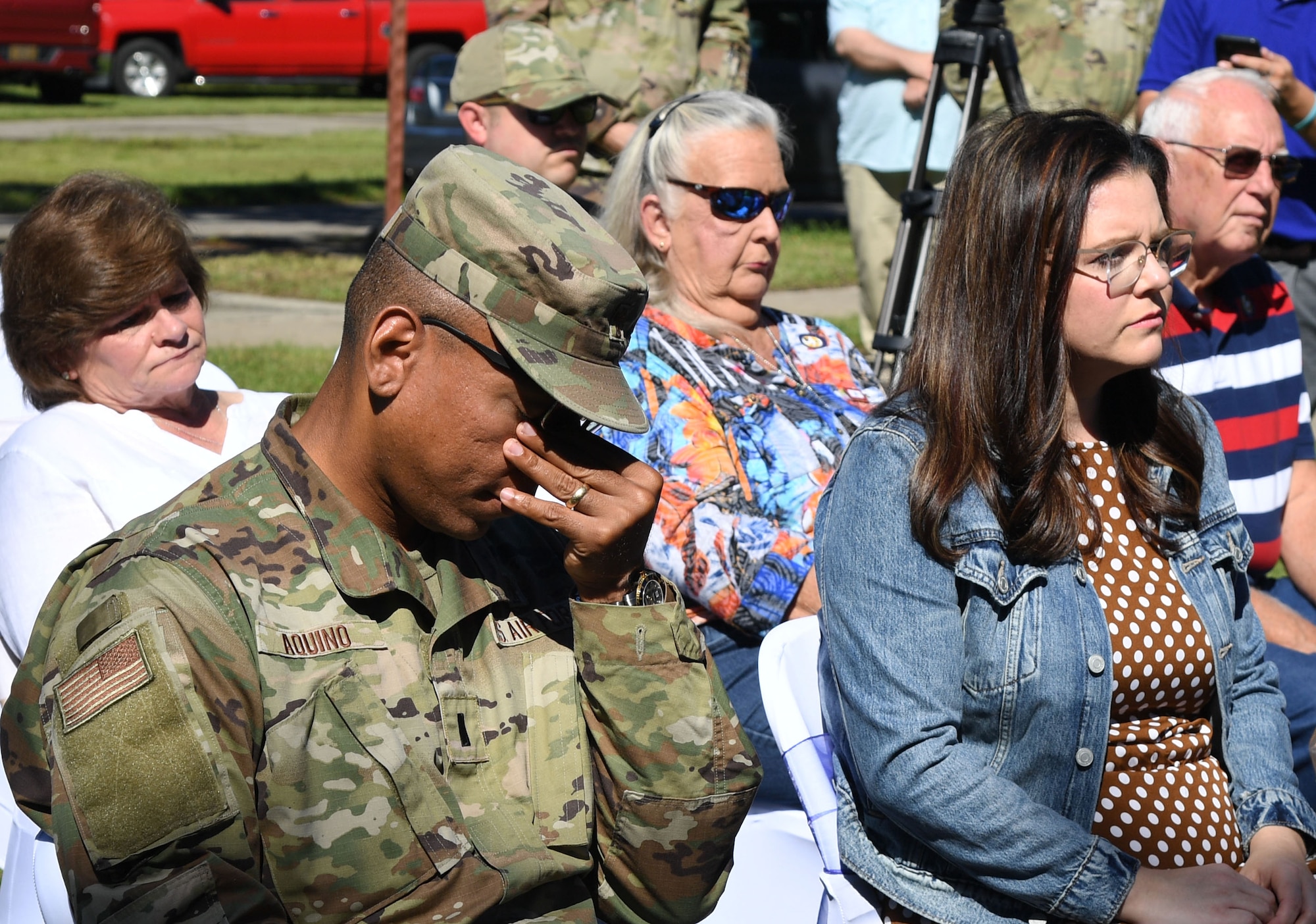U.S. Air Force Chaplain (1st Lt.) Angel Aquino, 81st Training Wing chaplain, wipes his eyes during the Air Force Families Forever Fallen Heroes Butterfly Garden dedication ceremony at the marina park at Keesler Air Force Base, Mississippi, Sept. 24, 2021. The garden was created as a designated location where the families of our fallen heroes can find a serene area to pay tribute to their loved one as well as honoring our fallen service members. (U.S. Air Force photo by Kemberly Groue)